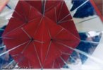 Imagem virtual de um poliedro obtida a partir de um caleidoscpio. Aqui pode-se ver o grande dodecaedro, um dos quatro poliedros estrelados regulares, no caleidoscpio relativo ao grupo de simetria do dodecaedro. 